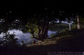 A stranger sitting on a river bank having a drink during a full moon.: by outoffocusprod, Views[762]