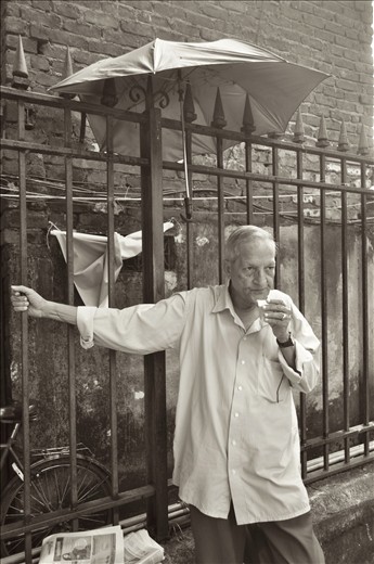 An umbrella does little for the old man