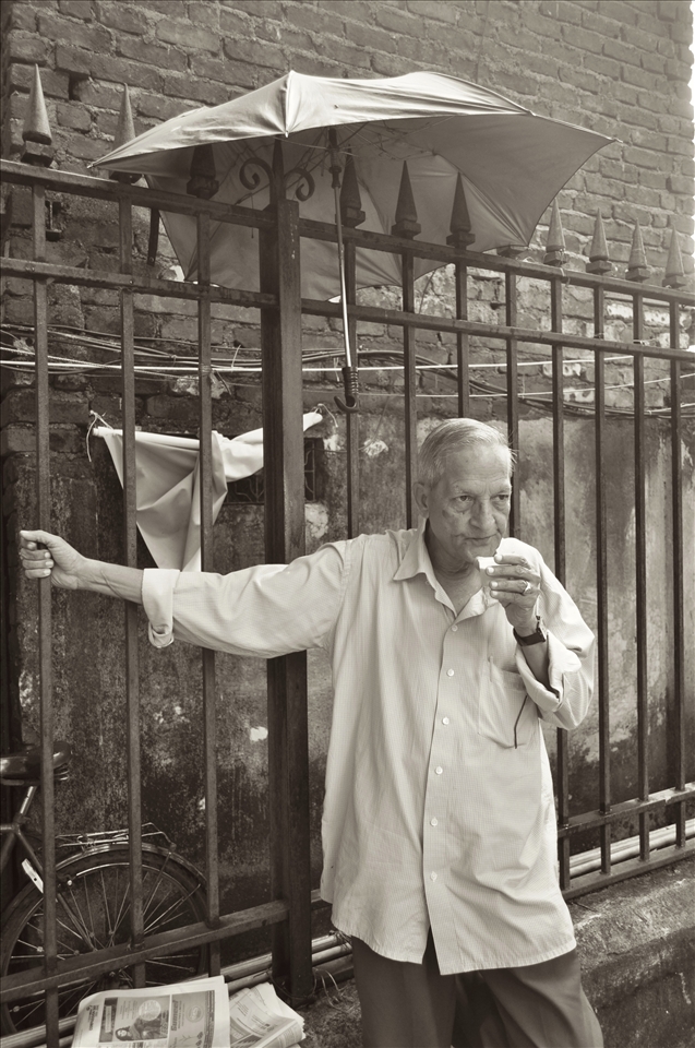 An umbrella does little for the old man