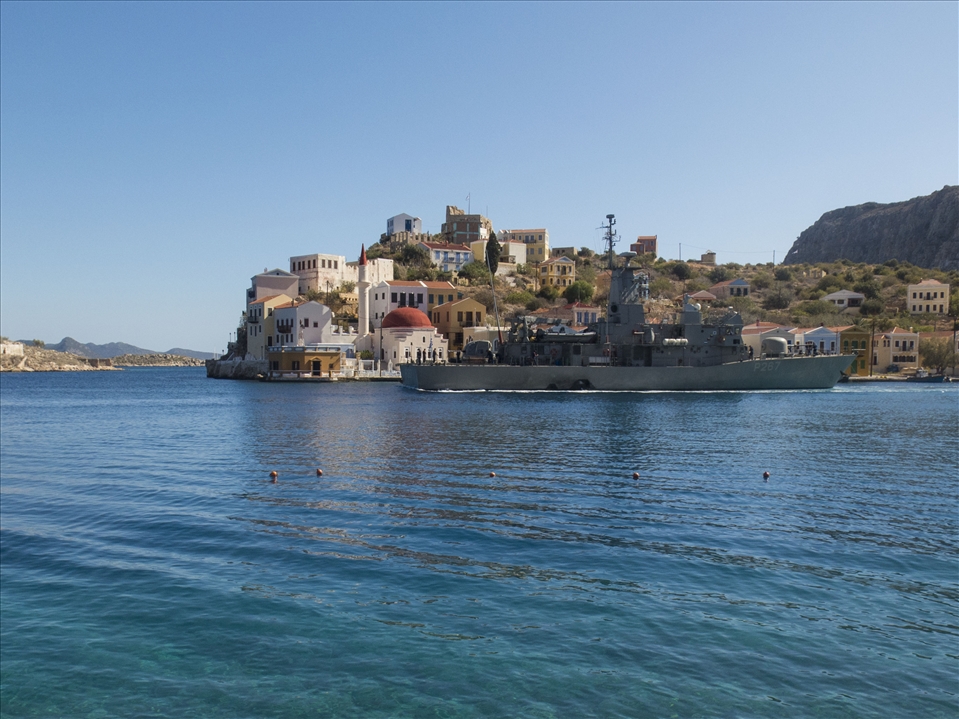 A warship leaving the harbour