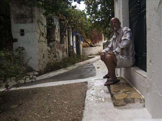 A man smoking in the alleys 