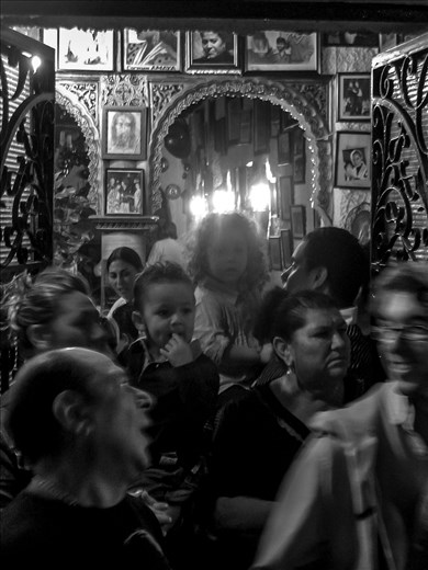 A popular bar in Plaza Larga, has its walls adorned with photos past dancers & singers 