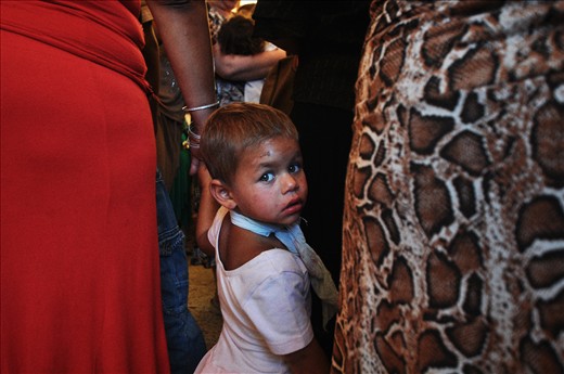 A little Roma girl waiting for her baptize