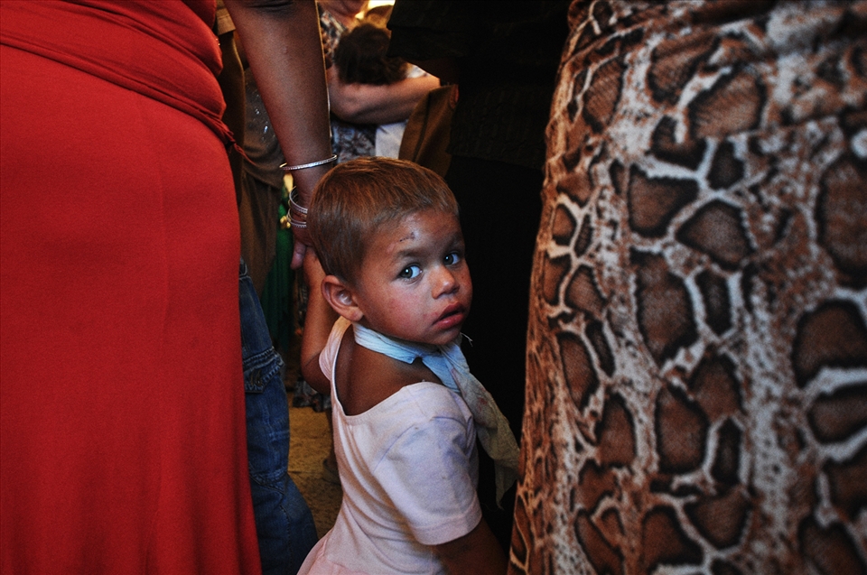 A little Roma girl waiting for her baptize