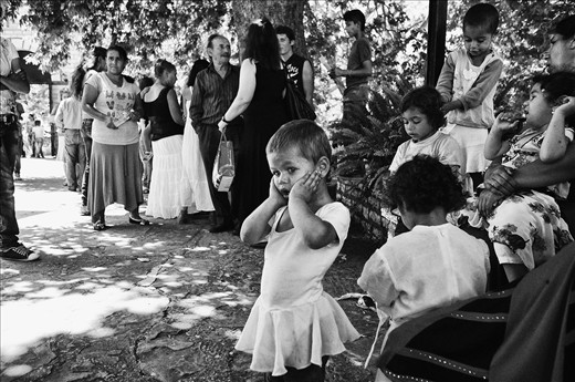 Roma waiting outside the monastery before baptize begin