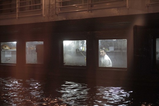 Tied one next to the other, the notorious cruise ships of the Nile are waiting for the next passengers. Their windows come closer, revealing stories never to be told.