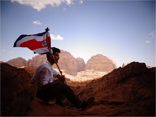 Contemplating the significance of what it meant for his people to reach their independence and wave the flag for the first time. 
