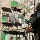 Armed Israeli soldiers walking through deserted Shuhada Street in Hebron, where the old Arab shops remain permanently closed. by: palestine Views[380]