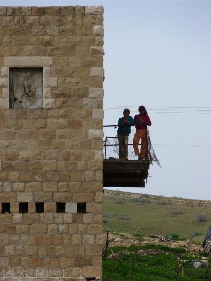 These sisters are two of eleven children who sleep, alongside their father and his two wives, together in one bedroom. The family live in the Jordan Valley - where poverty is deep but inequality is deeper still.