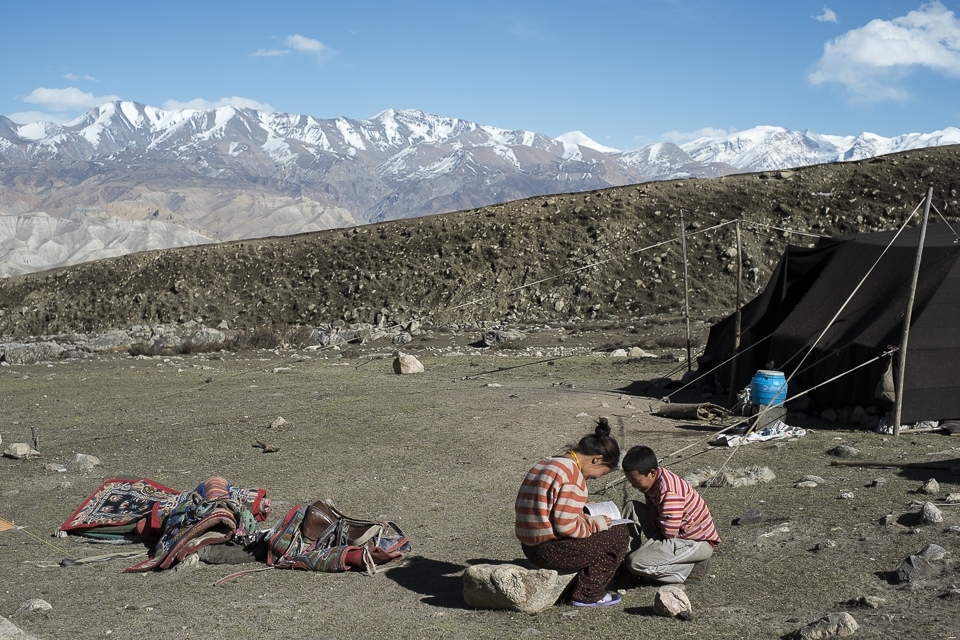 Karma is reading a book she brought from Kathmandu about interesting facts from around the world. The only way to stay connected with the other side in a way. Spring in the Himalayas is beautiful but among the striking landscapes lays harsh reality. The only person who Karma can open up about her aspirations is her little brother and random strangers. She loves her family yet big world has now taken a room in her heart.