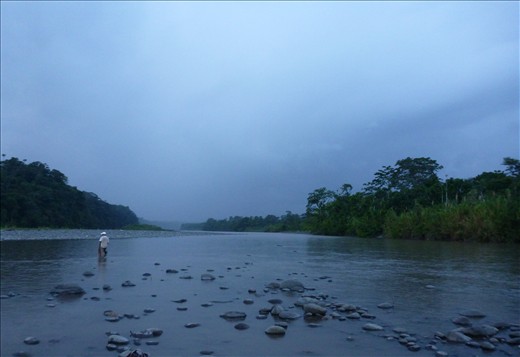 Ramiro, 22,  is looking for the best place to cross the river with his 