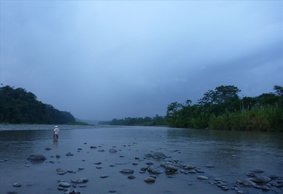 Ramiro, 22,  is looking for the best place to cross the river with his 