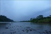 Ramiro, 22,  is looking for the best place to cross the river with his  Ramiro, 22,  is looking for the best place to cross the river with his