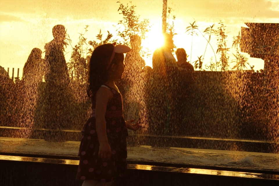 This photo was taken at the opening of Titan Square mall which has a fountain in which this child played happily, proving innocence and fantasy that a child can build on what we would see as boring
