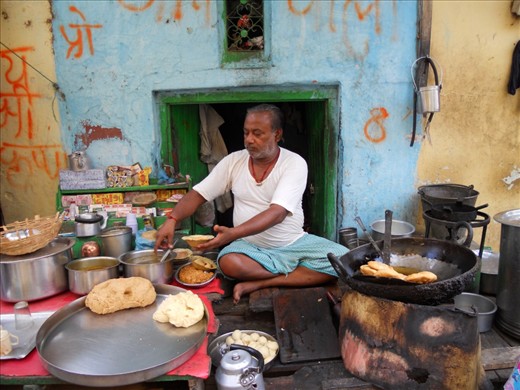 'Kachoris': Mathura is famous for three things - 'the sweet-pera', 'the birth place of Lord Krishna' and the 'Kachoris- made by stuffing wheat dough with lentils and frying them' only available in the mornigs. This is one of my similar shops serving the first kachoris of the day.