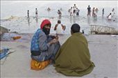 Two friends enjoy a homemade bong while watching men bathe in the Hooghly River: by passionatenomad, Views[291]
