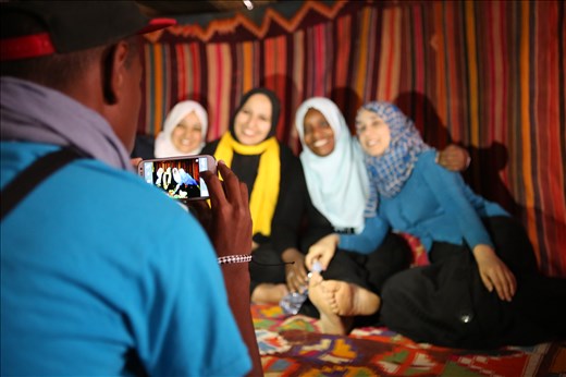 The dichotomy between old world traditions and the technology of the young. 