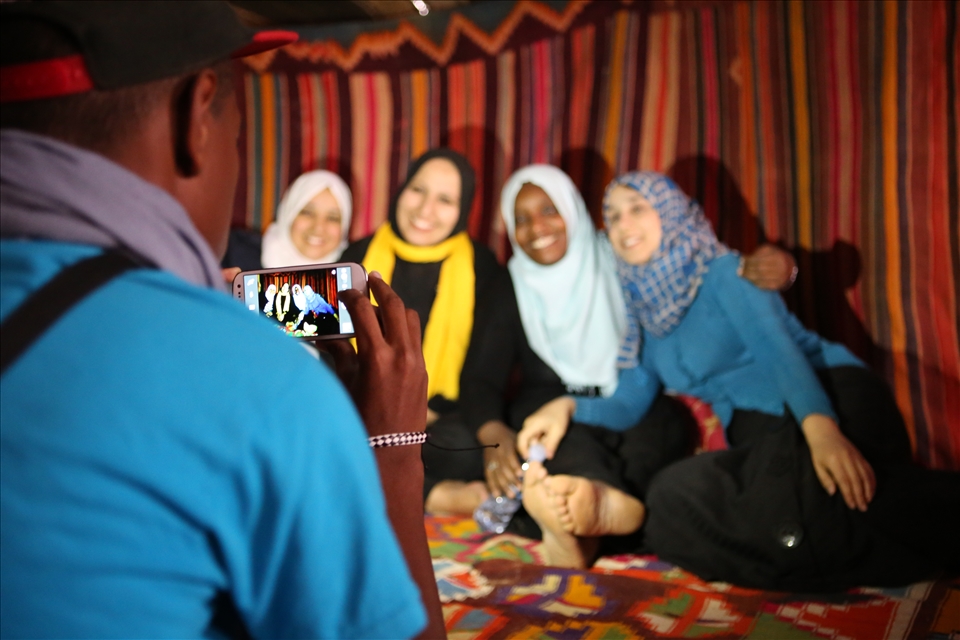 The dichotomy between old world traditions and the technology of the young. 