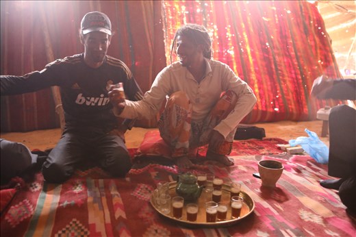 Tea is prepared and served. It is a hidden hospitality in the harsh desert.