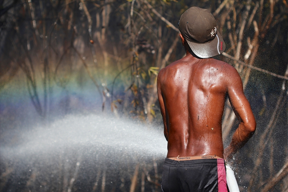 Bare-foot fire fighters working to save the forest from annual forest fires