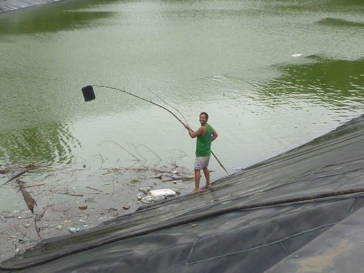 Fishing my laptop cover out of the lake after a massive gust of wind picked it up!