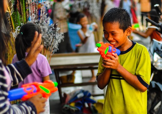 this religious festival is celebrated by children playing water war games