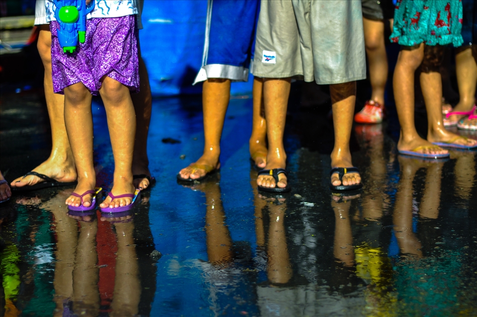 people who wishes to see the parade must also get themselves wet. it's a part of identification with the whole celebration