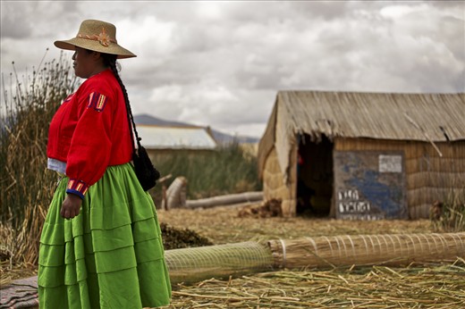 Uros Islands female inhabitant with her traditional clothes,all made by herself.