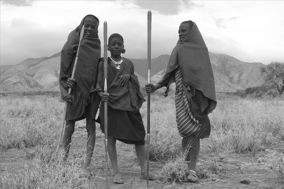 Responsibilty - Armed with their spears and sticks these young Masai Layonis(uncircumcised warriors) are charged with a very important job, to tend  to their cattle,goats and sheep. They will spend months alone on the East African Rift Valley floor always on guard over their animals. It is a big burden to bear for such youth.