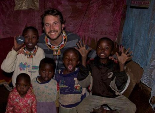 Posing with some of my Maasai students, inside a manyatta.
