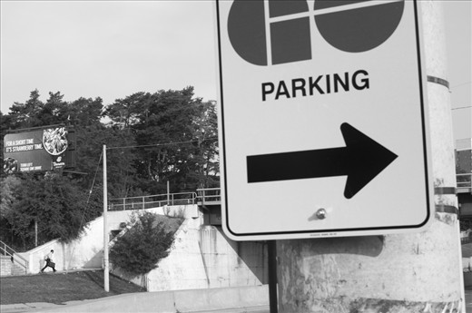 In the Greater Toronto Area, GO Transit provided rail and bus service to 239,000 commuters on a combined 3,200 kilometres of routes each weekday (GO Transit Annual Report 2011-2012). Most  need transit to promptly get to places of work in downtown Toronto. This lone male commuter sprints for a morning train from Cooksville Station to Union Station in Toronto, while signs instructing where to go and what to do, surround and dwarf him. I am a commuter too, and we run.