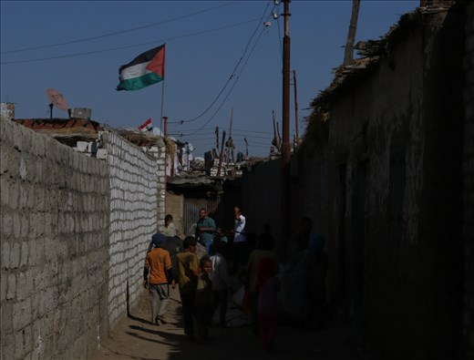  Flag of Palestine waves in one of the narrow streets of Fadel island, Ismaliya