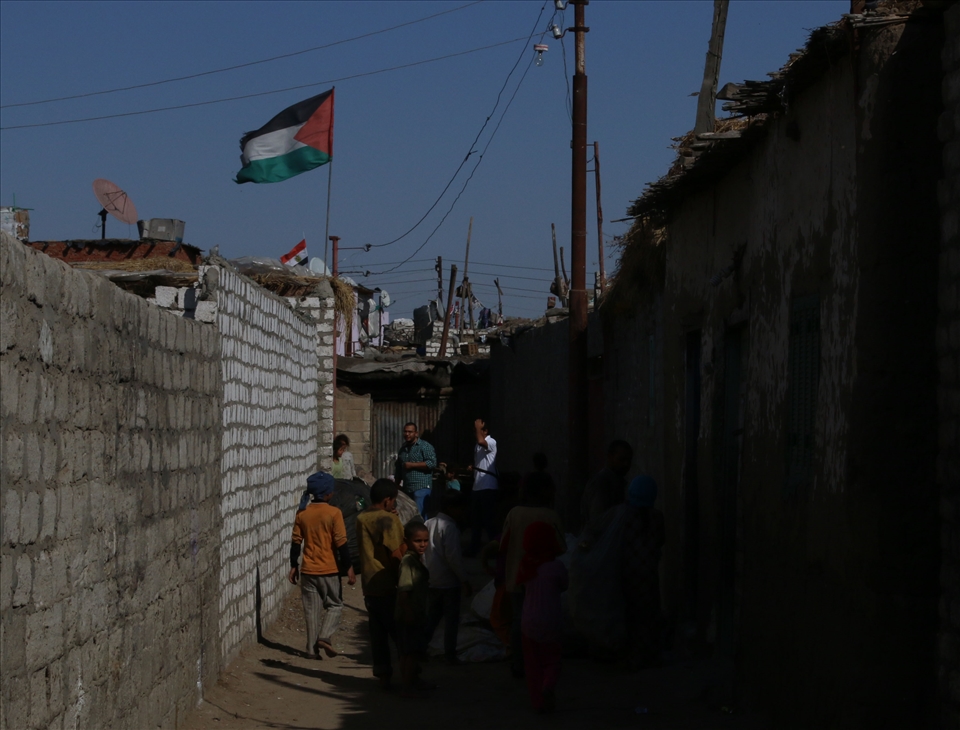  Flag of Palestine waves in one of the narrow streets of Fadel island, Ismaliya
