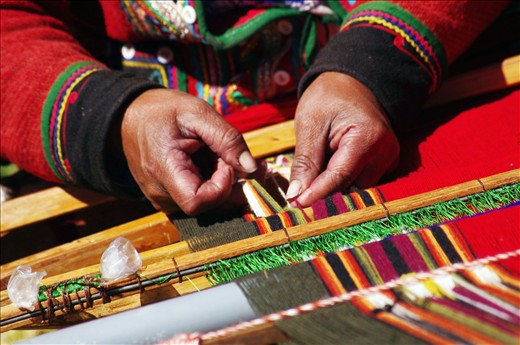 Peruvian hands braiding the wool 