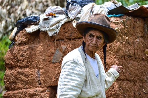 This woman is the definition of determination and resilience. She lives alone in a mud house with little to no food. Her children no longer take care of her, they have all moved to the city to find jobs and provide for their children. She is disabled and has very minimal use of her left hand. We visited her and brought her some food and offered to help wash herself and her clothing and bed linen. Initially she refused our help, out of sheer pride and weariness of five very pale strangers suddenly entering  her home. After reassuring her through our translator’s broken Quechua that we were not going to steal her clothes, we washed them in the river and laid them on the grass to dry beside her house. I took this photo as she was coming around the corner to check up on us and ensure that we were placing her wet belongings in the correct spot for optimal sunlight - even though there was a language barrier all of us still respected the fact that she knew best. 