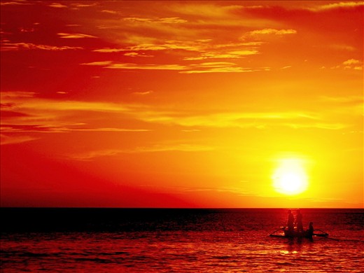 Fishermen at work at sunset