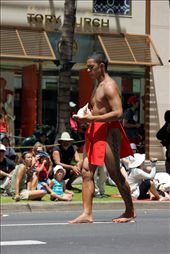Barefooted parade marshall walks on white line for respite from the hot asphalt.: by peterphoto, Views[160]