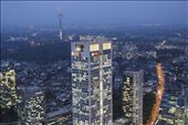 The modern side of Germany shown through a newer skyscraper Opernturm, Frankfurt. The small details play the role here, the television tower showing the development since 1970s and empty road in comparison with full offices suggest a hard-work of Germans on Monday evening.: by petraz, Views[508]