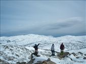 Three snowboarders enjoying a cool breeze after the hard hike up the mountain to enjoy the view.: by phill_merrick, Views[234]