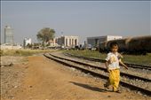 Phom Penh, Cambodia: Small children trudge their way into the city where they see how rich people live and to beg for money or sell goods so they can help contribute to their struggling families. After a long day this child wearily makes his way home with his days earning of 2 bags of nuts.: by phnompenh, Views[574]