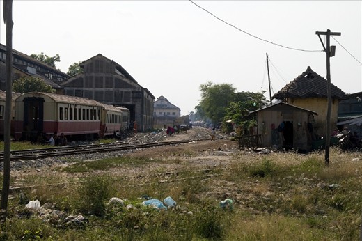 The contrast between buildings in the big city and the houses beside the train tracks that this child calls home couldn’t be greater. Even so this is home sweet home where the family ekes out an existence. 