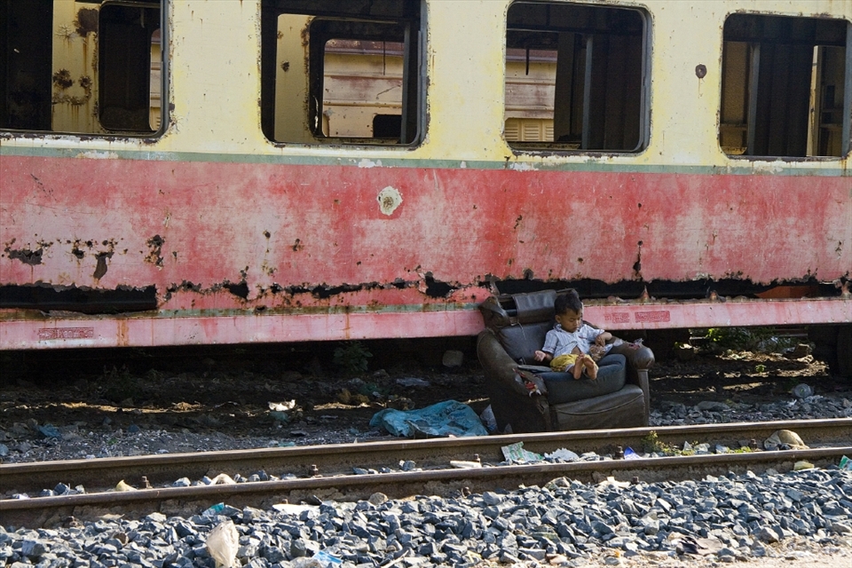Being poor means that children make the most of what is available around them. Tired and hungry after a long day it’s time for a quick rest for this little boy before continuing the journey home to his family and dinner. 