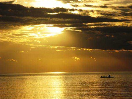 It looks like a fisherman after the breaking of the sky...Taken @ shore of Davao Oriental