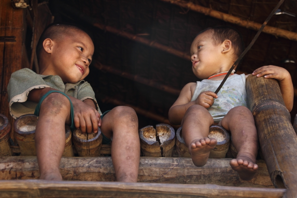 One of the many village homes made out of bamboo on stilts. 


Taken at Mae Saut Noi  village in  Mae Sariang - Mae Sot area in Thailand, the people are of the Karen tribe they are one of the many ethnic groups from Burma and have moved from their villages from Burma escaping the civil war conflict against them by the Burmese Military or extreme poverty their life's are much more free in Thailand than in Burma where it's very dangerous over their. 

This is one of the very few villages that are still very traditional way of living very simple life, they have no electricity or technology but they are happy living like this in their cozy bamboo huts. The kids play outside all day everyone cheeps in like washing clothes, cooking ect. The environment/hygiene isn't that clean as they are quite poor. It was a great and very nice atmosphere something that I have never experience before.

I captured mainly children in this rural village they were very excited seeing a foreigner and were most interested in my big slr camera as I was clicking away. 
