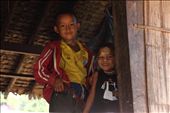 This was taken in one of the many traditional bamboo huts on stilts. These kids were in their home and i waved at them and smiled to ask them their photo they giggled especially the younger child on the right when I took their photo. They don't see any westerners or tourist in this rural country side of Thailand. None of them speak any English but I just weaved and they were more then happy to pose for me.


Taken at Mae Saut Noi  village in  Mae Sariang - Mae Sot area in Thailand, the people are of the Karen tribe they are one of the many ethnic groups from Burma and have moved from their villages from Burma escaping the civil war conflict against them by the Burmese Military or extreme poverty their life's are much more free in Thailand than in Burma where it's very dangerous over their. 

This is one of the very few villages that are still very traditional way of living very simple life, they have no electricity or technology but they are happy living like this in their cozy bamboo huts. The kids play outside all day everyone cheeps in like washing clothes, cooking ect. The environment/hygiene isn't that clean as they are quite poor. It was a great and very nice atmosphere something that I have never experience before.

I captured mainly children in this rural village they were very excited seeing a foreigner and were most interested in my big slr camera as I was clicking away. 
: by photodoc, Views[819]