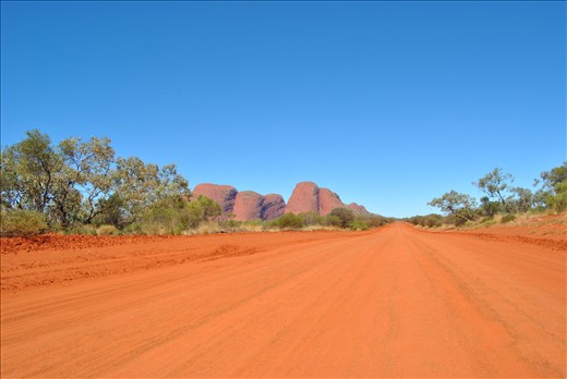 Long way to go.- Australian orange desert and deep blue skies; Kata Tjuta leads 