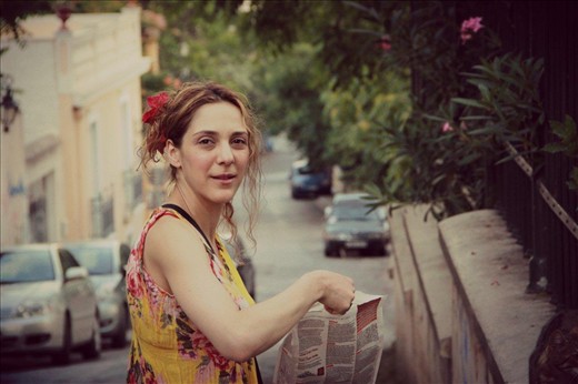 An actress feeding all cats around Athens Acropolis