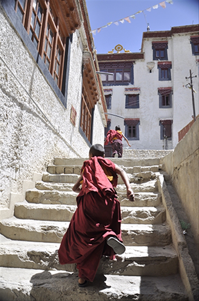 Lunch Break at Lamayuru Monastery. Young monks on the run 