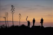 Nico, Jason, and Steven. Standing beside Isla Vista's iconic agave stalks, these men exist in a time capsule culture blending humans and nature. Most days drift along consumed by an ocean-minded notion that transcends the conventional expectations of the outside world. The illuminated oil rig resting behind them is a compelling reminder of the areas ongoing struggle for balance with the land and its resources.: by photosforpreservation, Views[774]