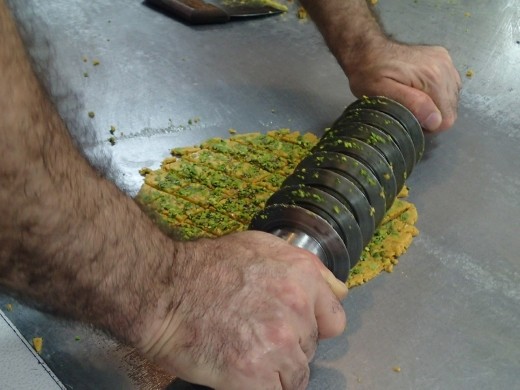 Iran - Qom - cutting the finished sohan into diamond-shaped pieces